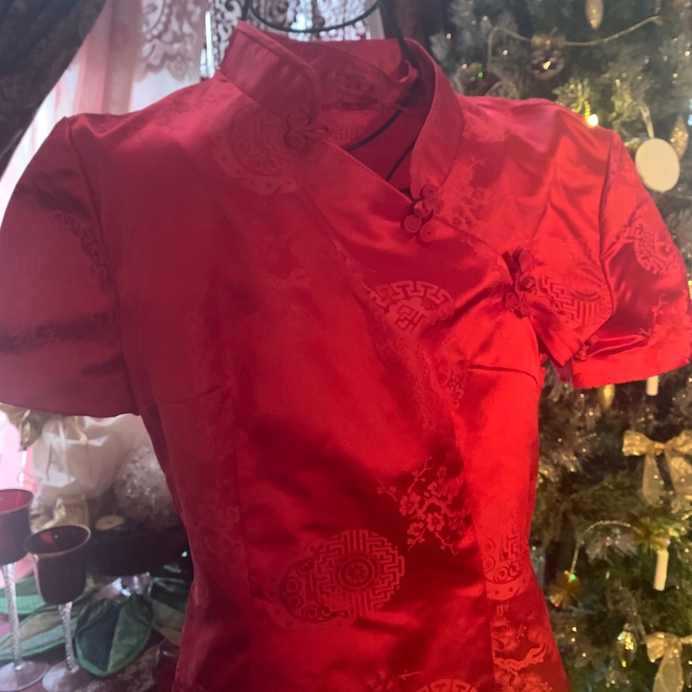 Mandarin color gorgeous deep red dress .